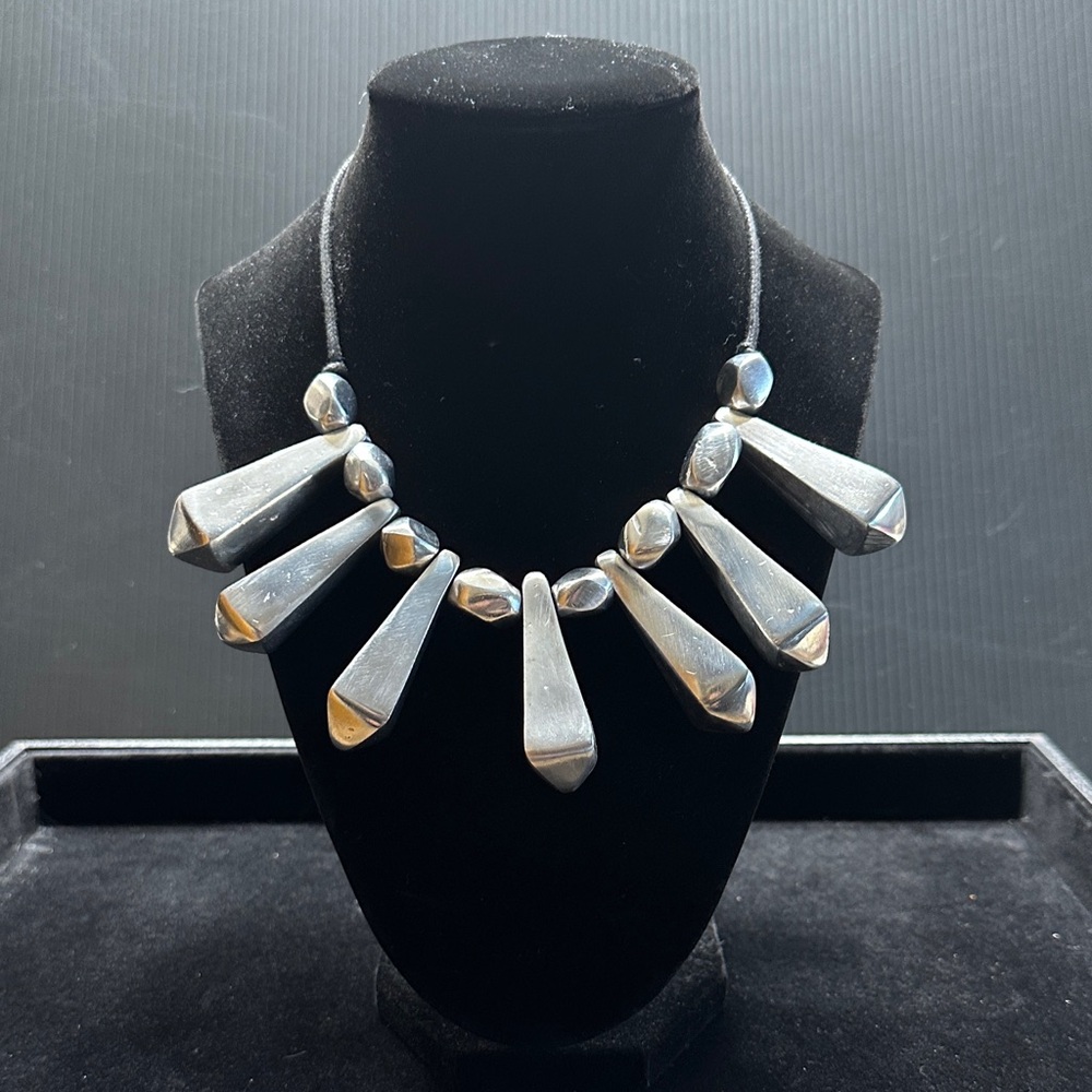 Unique Silver Necklace with drawstring tie to adjust to favorite length.